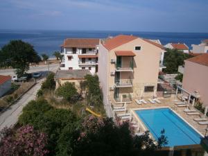 a view of a building and a swimming pool at Petros Studios in Poros