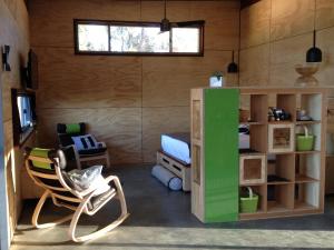 a room with a room with a bed and a chair at Bed + Bauhaus in Yallingup