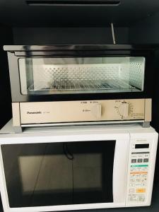 Kuchyň nebo kuchyňský kout v ubytování Tomamu Hostel