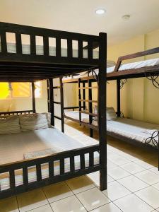 a group of bunk beds in a room at Phi-Phi Beach Resorts & Hotel in Bataan