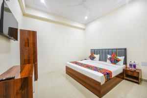 Postel nebo postele na pokoji v ubytování FabHotel Palm Paradise + 22 fotografií