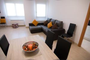 a living room with a couch and a table at Apartament Bagà in Bagá