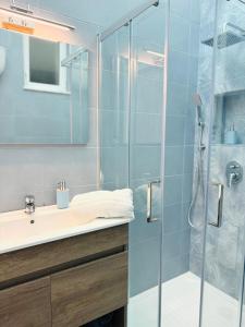 a bathroom with a glass shower and a sink at Ruggiero house Pompei in Pompei +21 photos