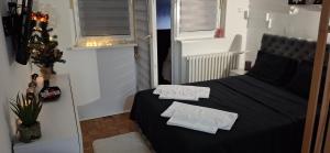 Postel nebo postele na pokoji v ubytování AIK Kula studio + 31 fotografií