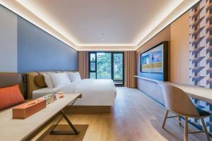TV/trung tâm giải trí tại Orange Hotel Guilin Yangshuo West Street Branch