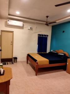Postel nebo postele na pokoji v ubytování Aishwaryam home stay