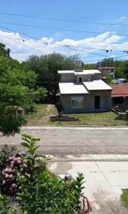 a house sitting on the side of a street at Happy House in Tanti +3 photos