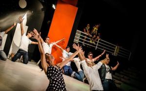 a group of people on a stage with their hands in the air at Villaggio Turistico La Mantinera - Hotel in Praia a Mare +102 photos