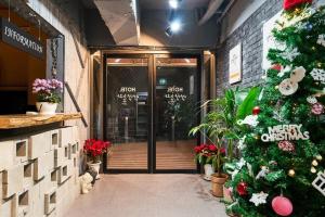 a christmas tree is in front of a store at Hotel Yangyang Nolja in Yangyang