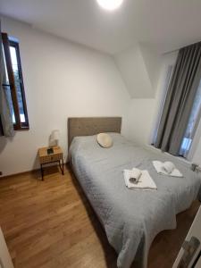 Postel nebo postele na pokoji v ubytování Apartman Nina Divcinova