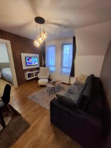 TV a/nebo společenská místnost v ubytování Apartman Nina Divcinova