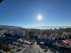 an aerial view of a city with buildings and the ocean at Magic VieW Luxury Penthouse with Jacuzzi and Sea view in Split