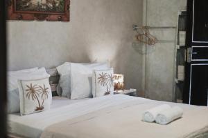 Voodi või voodid majutusasutuse Lost Paradise Gili toas