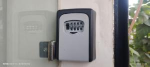 a security box on the side of a door at Utopia Guest house for men in New Town