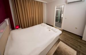 Postel nebo postele na pokoji v ubytování Dalyan Elit Apart Otel