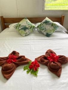 a bed with towels on top of it at Room With A View & Apartment Style in Port Vila