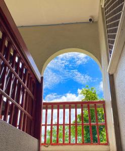 an archway with a view of the sky from a balcony at Room With A View & Apartment Style in Port Vila