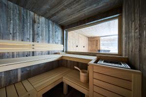 a sauna with a window and a keyboard in it at NANI - Mountain Chalet in Saalbach-Hinterglemm