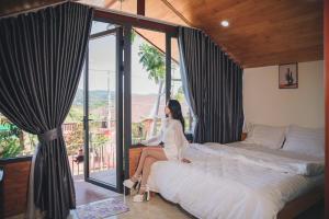 Voodi või voodid majutusasutuse Khu Nghỉ Dưỡng View Triệu Mây toas