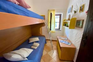 Ένα ή περισσότερα κρεβάτια σε δωμάτιο στο Casa Il Giardino Di Peppino