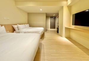 Voodi või voodid majutusasutuse Brown House Hotel - Taipei Main Station toas