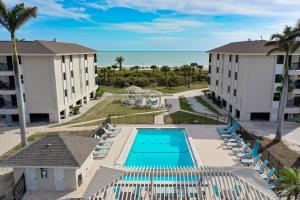 an aerial view of the resort with a swimming pool and the ocean at Sanddollar #A202 in Ybel