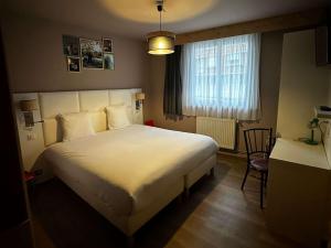 Postel nebo postele na pokoji v ubytování greet hotel Lille Gare Flandres - Groupe Accor