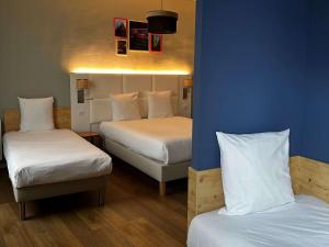 Postel nebo postele na pokoji v ubytování greet hotel Lille Gare Flandres - Groupe Accor