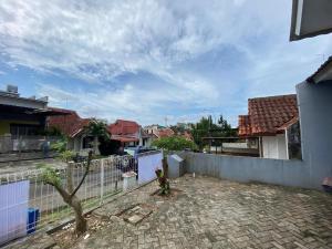 a view of a house with a fence at Himawari House in Batam Center