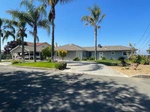 a house with palm trees on a street at Views on the Hill in San Jose
