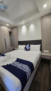 Postel nebo postele na pokoji v ubytování Hotel Akshaya