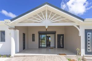 a white house with a large open door at Villa Mélina in Capesterre-de-Marie-Galante +39 photos