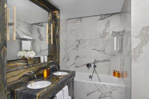 Ein Badezimmer in der Unterkunft Hôtel Métropole Genève