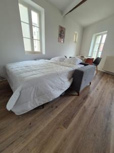 Кровать или кровати в номере L arena, vue imprenable sur les anciennes arènes