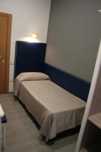 Postel nebo postele na pokoji v ubytování Hotel Magenta