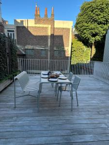 a table and two chairs on a patio at Living Gent in Ghent
