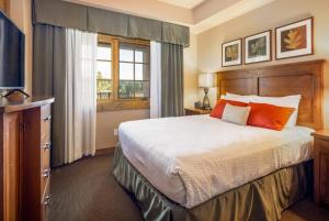 a bedroom with a large bed and a window at Suncadia Trailhead 1 Pet Friendly Condo 203 in Cle Elum +13 photos