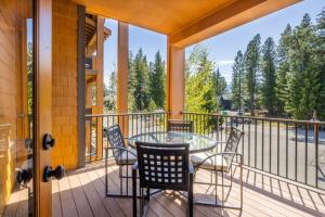 a patio with a table and chairs on a balcony at Suncadia Trailhead 1 Condo 208 in Cle Elum