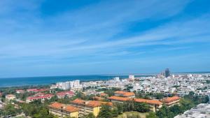 a view of a city with buildings and the ocean at Sea La Vie Tuy Hoa Beachside Studio in Tuy Hoa