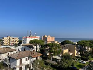 a city with buildings and the ocean in the background at Casa Mia Lido Adriano II in Lido Adriano