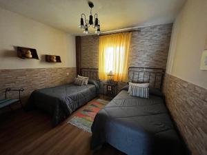 Postel nebo postele na pokoji v ubytování Rosancha