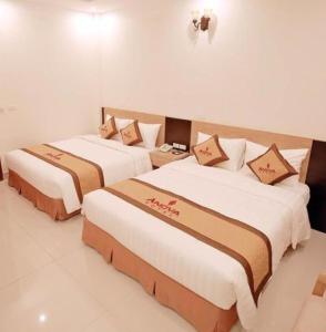 Postel nebo postele na pokoji v ubytování Anova 2 Hotel