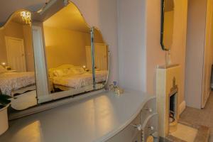 a bathroom with a large mirror on a counter at 107a - 3 Double Bedrooms in Lytham St Annes +41 photos