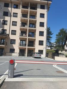 a car parked in front of a large building at Vila Elsa in Zlatibor