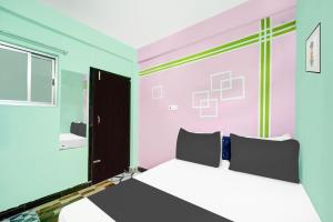 Ένα ή περισσότερα κρεβάτια σε δωμάτιο στο Hotel O R K RESIDENCY