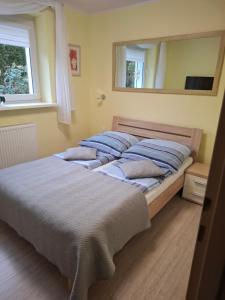 Posteľ alebo postele v izbe v ubytovaní APARTAMENT WŁODEK