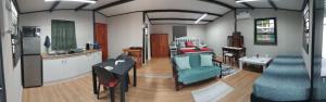 a room with a kitchen and a living room at Nadine's Self-Catering - Freedom in Stormsrivier