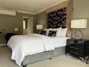 Letto o letti in una camera di Patcham Place & Lilliput House, Clarens