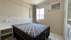 a bedroom with a bed in a room with a window at Thermas Paradise Apartamentos Rio Quente Esplanada in Rio Quente +58 photos