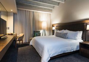Ένα ή περισσότερα κρεβάτια σε δωμάτιο στο Movich Hotel Las Lomas